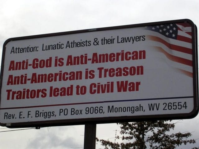a large white sign with red text