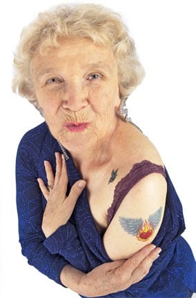 an old woman with a tattoo on the arm