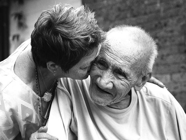 a man and woman kissing