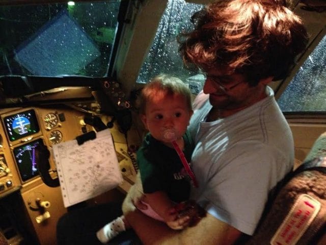 a man holding a baby