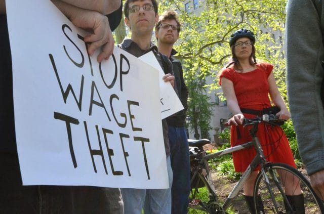 a group of people holding a sign