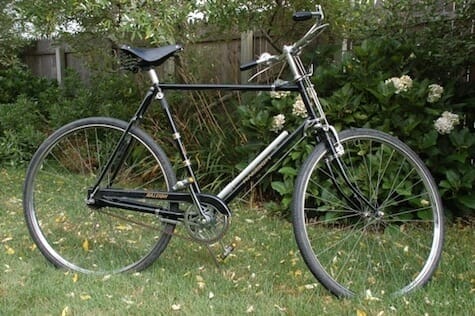 a bicycle parked in a yard