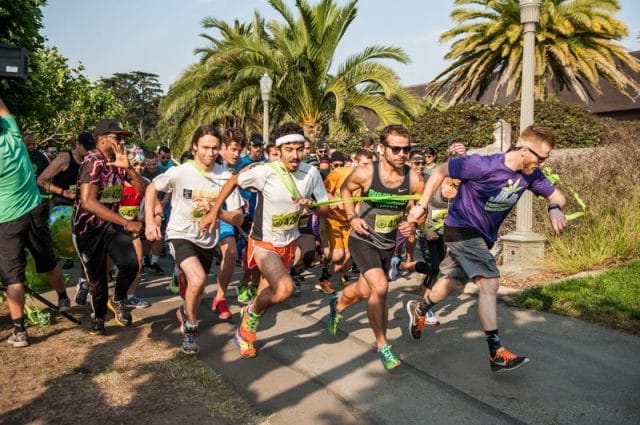 a group of people running on a road