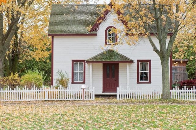 a white house with a red door