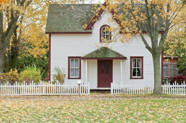 a white house with a red door