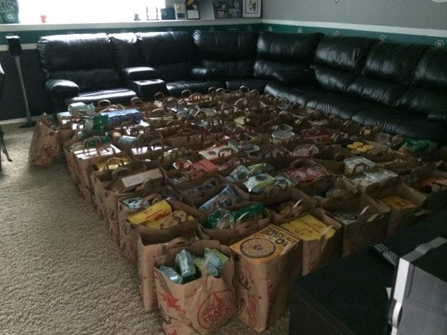 a large room with a couch and boxes of food