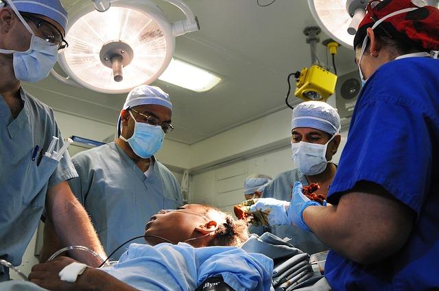 a group of surgeons performing surgery