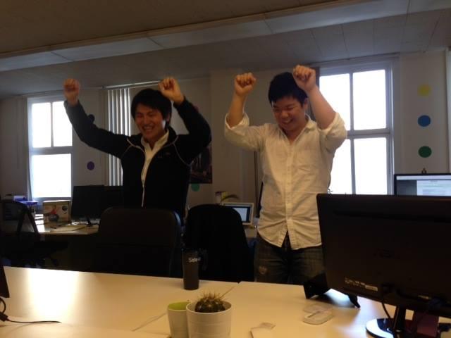 a couple of men raising their hands