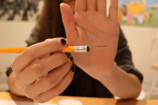 a person holding a pen