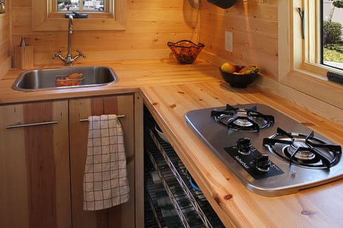 a kitchen with a stove and sink