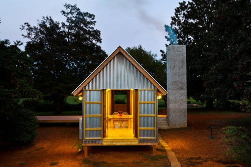 a small building with a fire pit