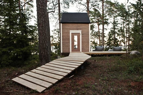 a small wooden cabin in the woods