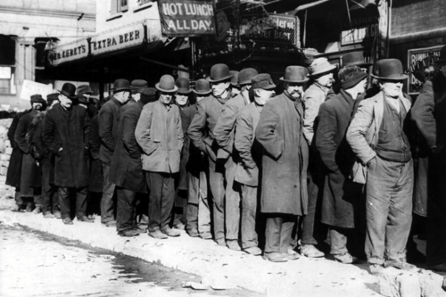 a group of men standing in the snow