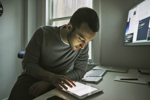 a man looking at a computer screen