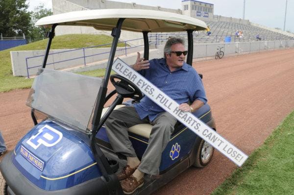 a man in a golf cart