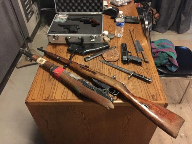a group of guns on a table