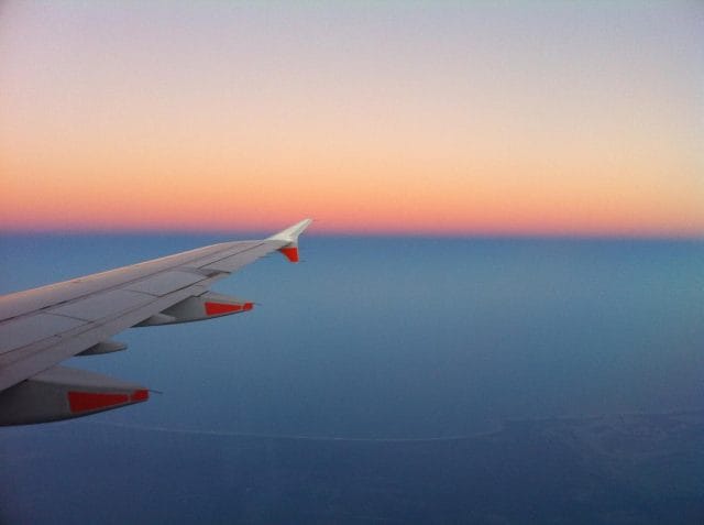 an airplane wing in the sky