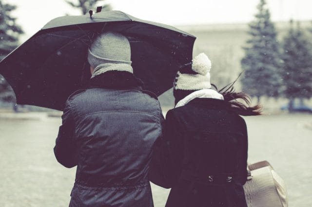 two people with umbrellas