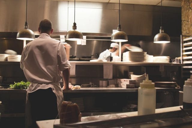 a chef cooking in a restaurant kitchen