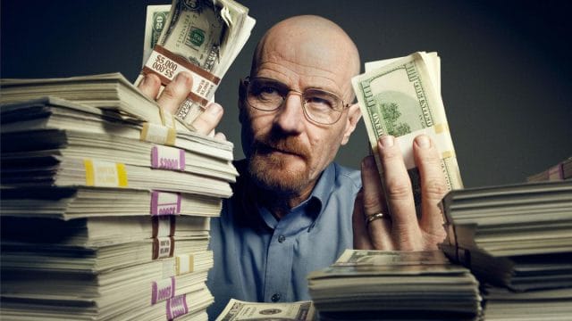 Bryan Cranston holding up some money