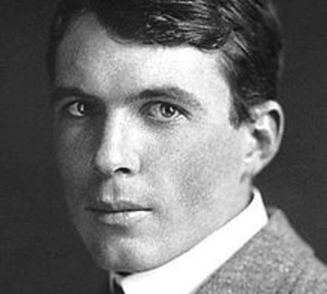 William Lawrence Bragg with a serious expression