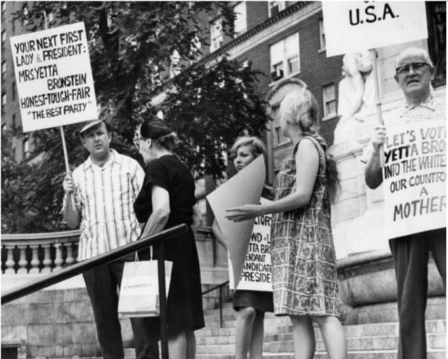 a group of people holding signs
